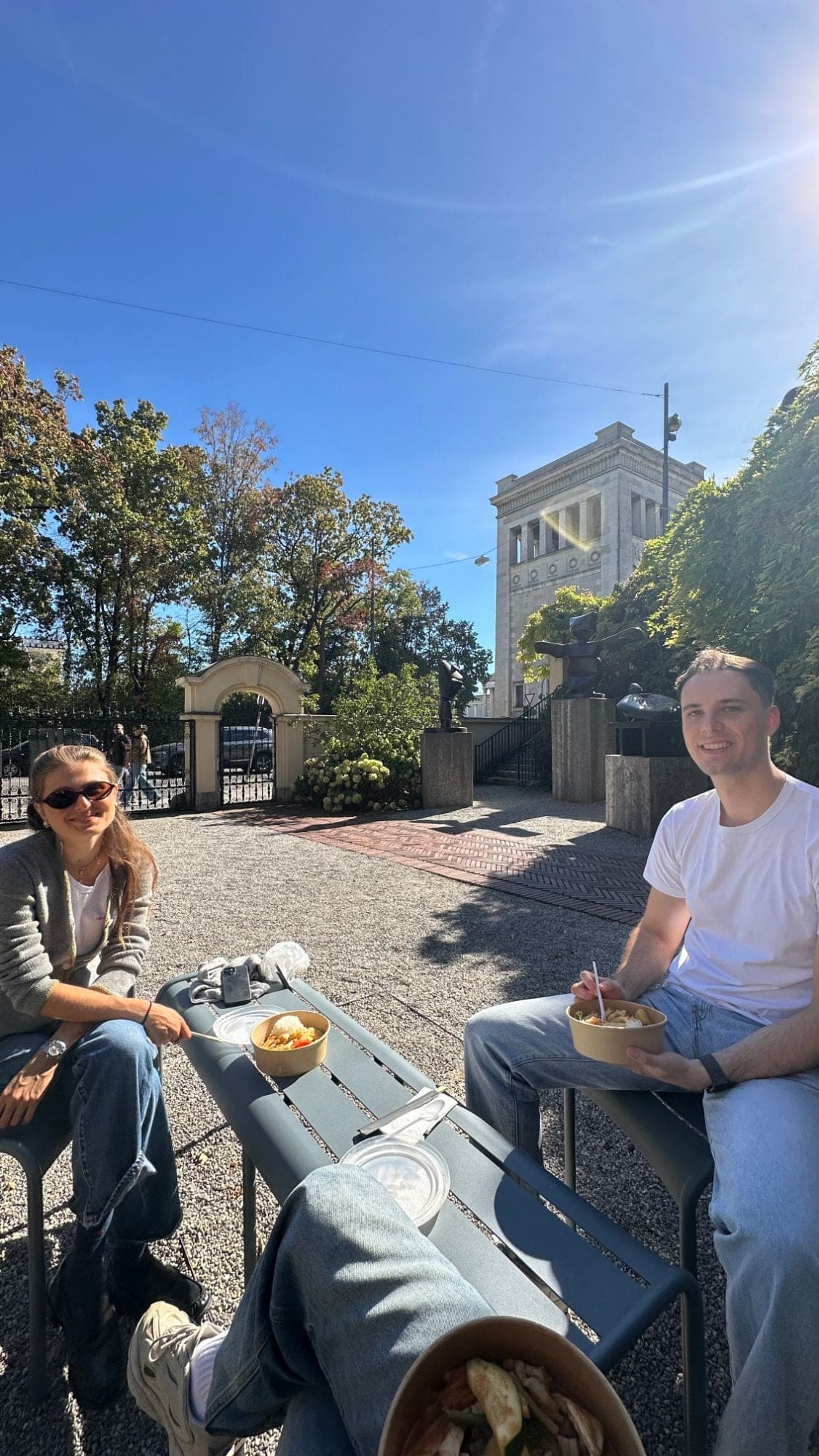 The team having lunch outside in the sun